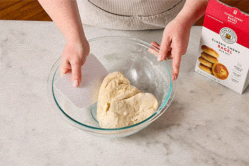 Animated gif showing how to fold, mix, and kneed bagel dough.