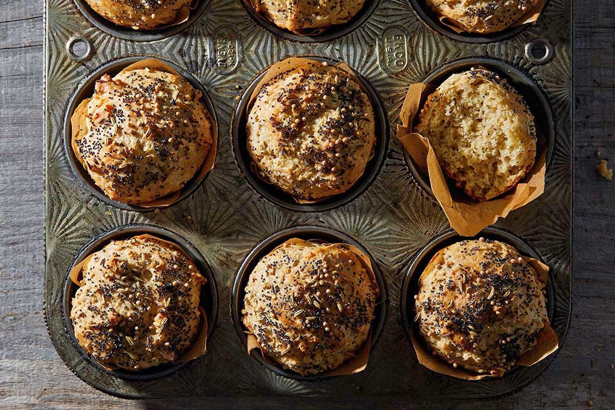 Sour cream rye muffins in a muffin tin