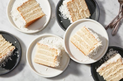 Slices of Coconut Layer Cake on plates - select to zoom