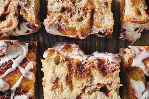 Cinnamon Roll Focaccia laid out on a cutting board - select to zoom