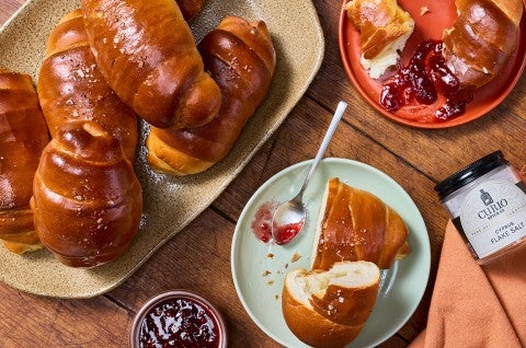 Salt Bread arranged on a table with jelly. - select to zoom