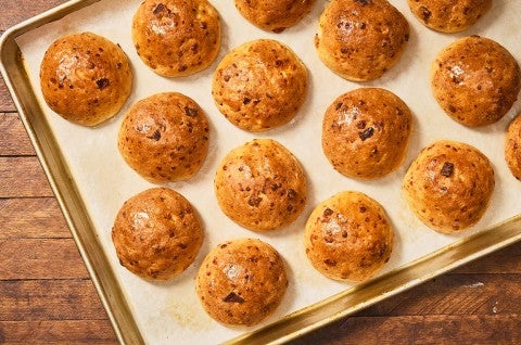 Gluten-Free Bacon Cheddar Rolls on a sheet tray fresh out of the oven. - select to zoom