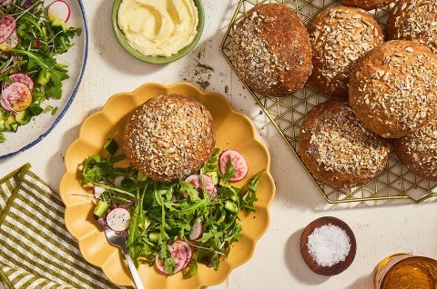 Gluten-Free Seeded Hearth Rolls on a table. - select to zoom