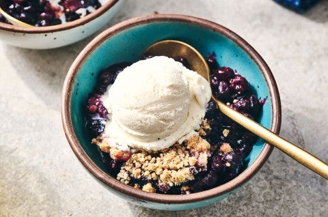 Blueberry Crisp topped with vanilla ice cream in a blue bowl - select to zoom