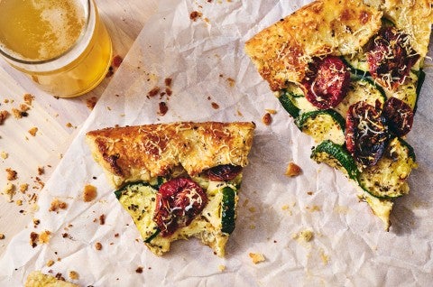 Savory Zucchini Galette sliced and partially eaten on a counter, seen from above - select to zoom