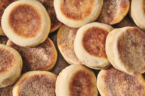 Sourdough English Muffins arranged on a counter and seen from overhed - select to zoom