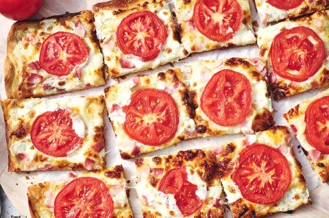 BLT Pizza sliced on a counter - select to zoom