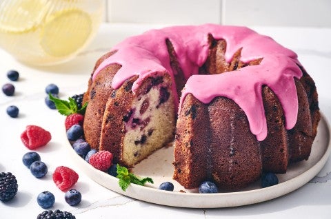 Berry Bliss Bundt Cake seen from the side with berries around the edges - select to zoom