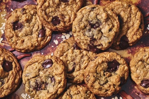 Multiple whole wheat oatmeal cookies arranged on a counter seen from above - select to zoom