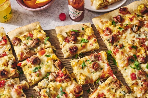 Sliced breakfast pizza on a counter - select to zoom