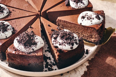 Sliced Chocolate Cheesecake on a plate. - select to zoom