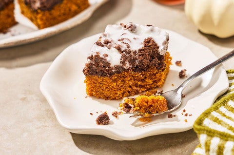 Chocolate Pumpkin Crumb Cake on a plate with a bite on a fork. - select to zoom