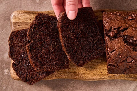 Double Chocolate Zucchini Bread sliced on a cutting board - select to zoom