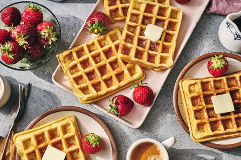 Waffles arranged on plates with fresh fruit - select to zoom