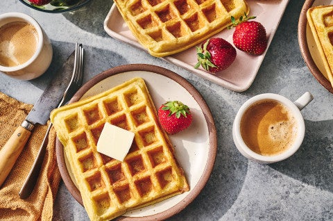 Waffles arranged on plates with fresh fruit - select to zoom