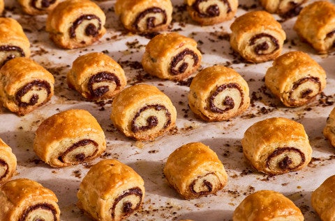 Chocolate Croissant Cookies fresh out of the oven on parchment paper - select to zoom