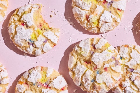 Sprinkle Crinkle Cookies arranged on a light lavender background - select to zoom