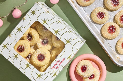 Almond Thumbprints in a gift box, a plate, and on a baking sheet - select to zoom