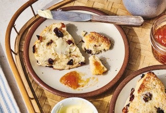 A Cream Tea Scones broken up on a plate
