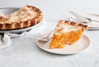 Slice of peach pie