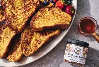 French Toast on a plate with a jar of Maple Cinnamon from King Arthur Baking