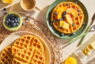 Classic Buttermilk Waffles arranged on a table seen from above.