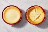 Whole cheesecake next to a cracked cheesecake