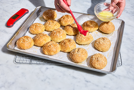 Brushing butter onto Gluten-Free Rolls & Buns