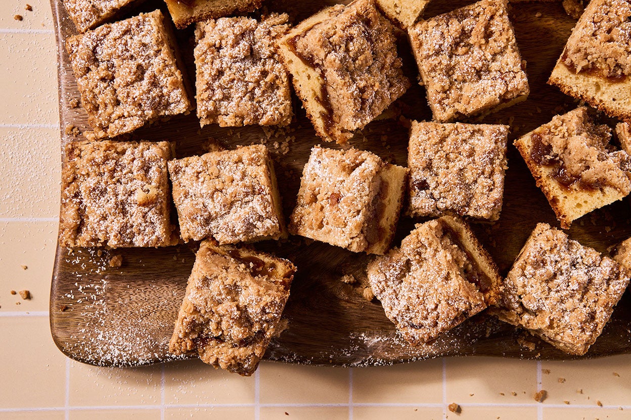Apple Crumb Cake sliced up and arranged on a cutting board