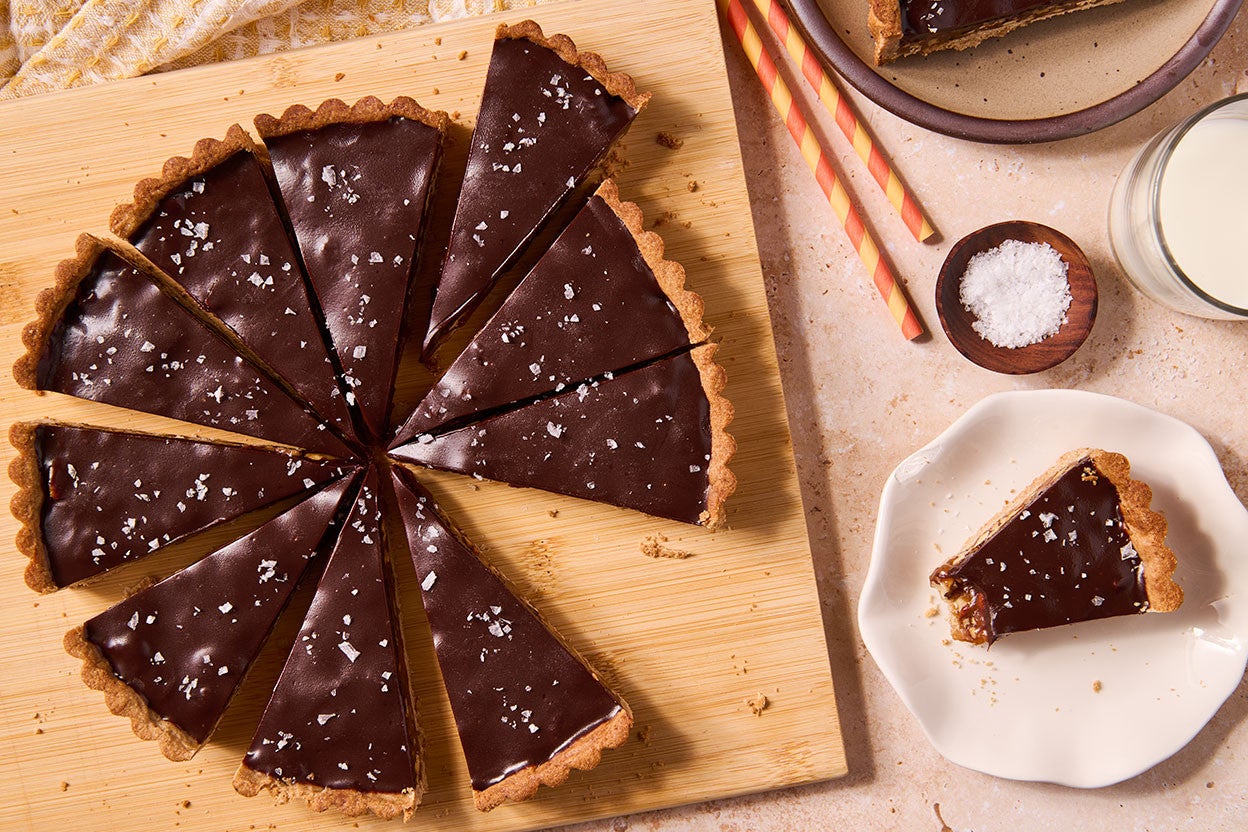 Candy Bar Pecan Tart seen from above - sliced on a cutting board