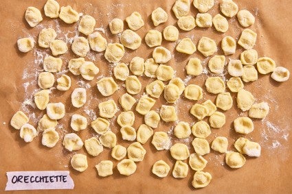 Orecchiette pasta shape on a parchment-line baking sheet