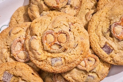 Malted Peanut Butter Chocolate Chip Cookies stacked on a plate