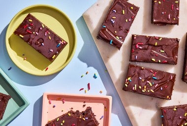 Homemade Cosmic Brownies served on plates and cutting board
