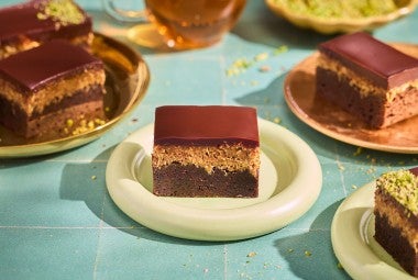 Dubai Chocolate Brownies on plates arranged on a counter