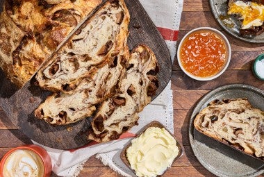 Apple Cinnamon Sourdough Bread sliced and seen from above with decorations on a counter