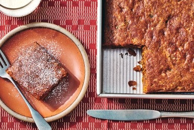 Spicy Cake Pan Cake in a King Arthur Baking square baking pan and a slice on a plate.