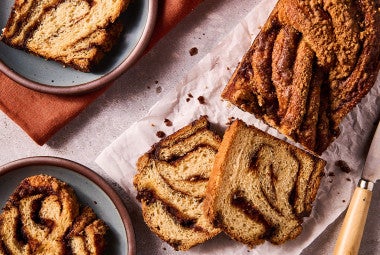 Cinnamon Babka slices arranged on a counter with thick swirls of cinnamon