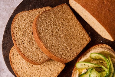 Classic 100% Whole Wheat Bread sliced on a cutting board